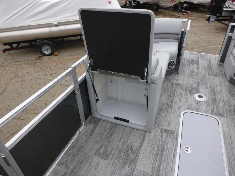 Slide: The Image of 2024 Ranger Reata 223C boat interior with gray flooring and seating. - 23