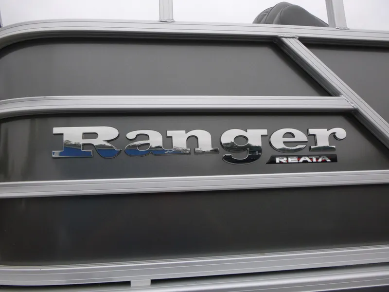 Slide: The Image of 2024 Ranger Reata 223C boat logo on sleek gray surface. - 37