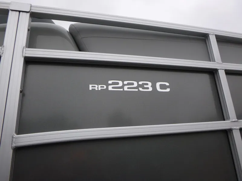 Slide: The Image of 2024 Ranger Reata 223C boat detail with model name on side panel. - 38