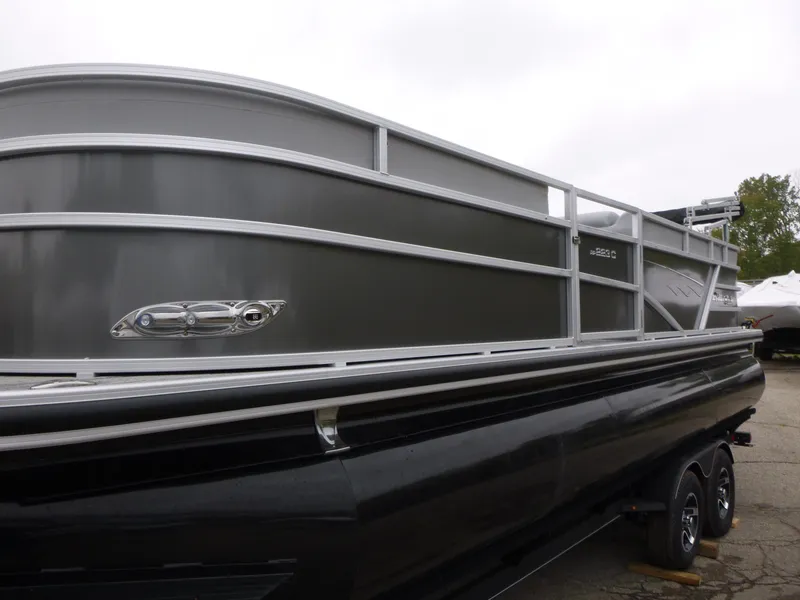 Slide: The Image of 2024 Ranger Reata 223C pontoon boat, sleek design, gray and black exterior. - 8
