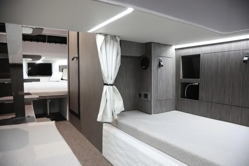 Slide: The Image of Interior of 2025 Ranieri CAYMAN 45.0 Cruiser, featuring modern design and comfortable sleeping area. - 18