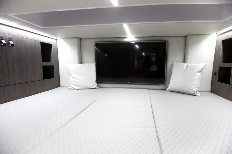 Slide: The Image of Luxurious interior of 2025 Ranieri CAYMAN 45.0 Cruiser with modern bedding and TV. - 19