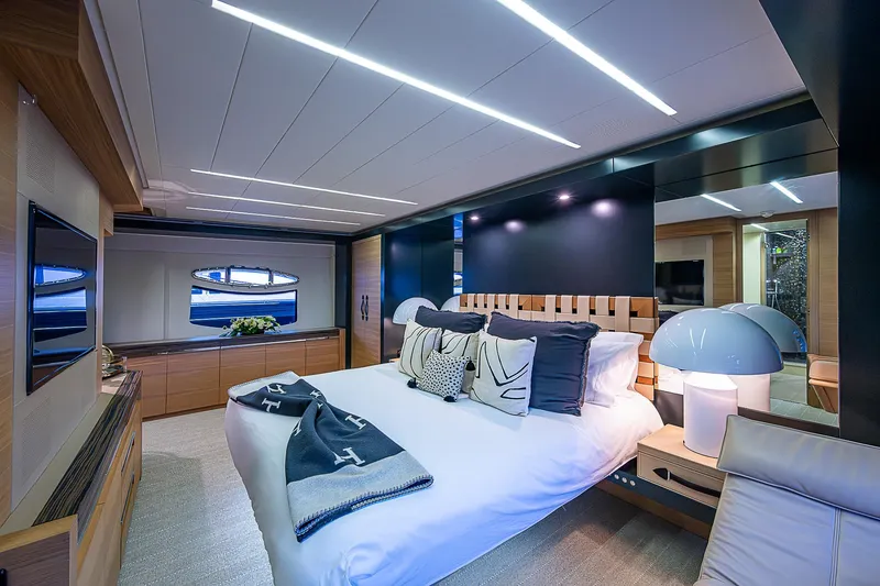 Slide: The Image of Luxurious bedroom interior of 2014 Pershing 92 yacht with modern decor and ambient lighting. - 12
