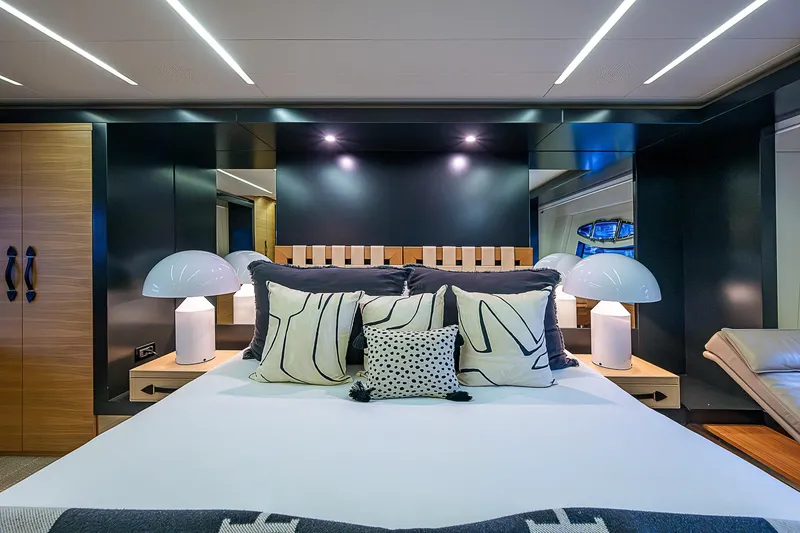 Slide: The Image of Luxurious bedroom interior on 2014 Pershing 92 yacht with modern decor and ambient lighting. - 13