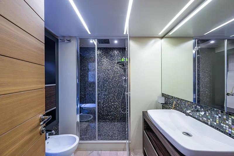 Slide: The Image of Luxurious bathroom on 2014 Pershing 92 yacht with modern fixtures and sleek design. - 14