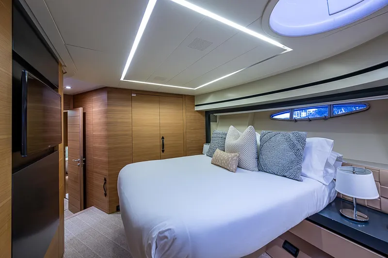 Slide: The Image of Luxurious bedroom interior of 2014 Pershing 92 yacht with modern design and cozy bedding. - 16