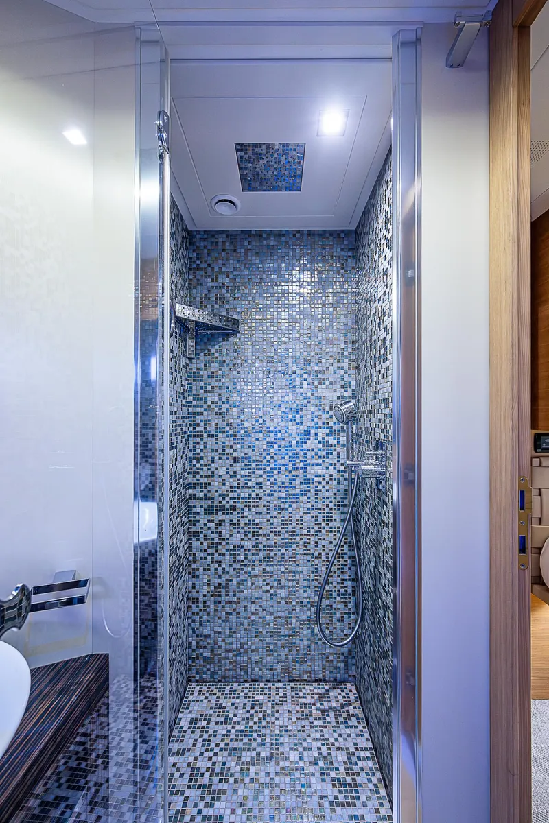 Slide: The Image of Luxurious mosaic-tiled shower in 2014 Pershing 92 yacht bathroom. - 24