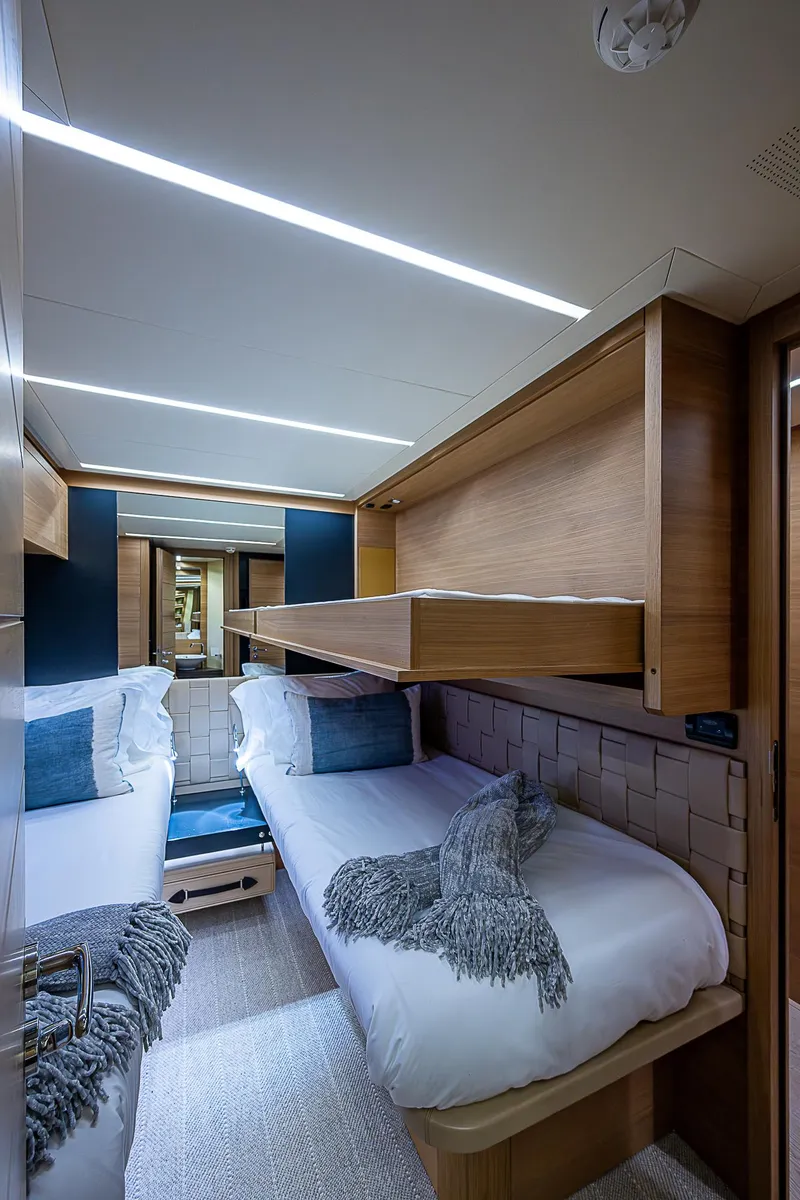 Slide: The Image of Luxurious cabin interior of 2014 Pershing 92 yacht with modern design and cozy bedding. - 26