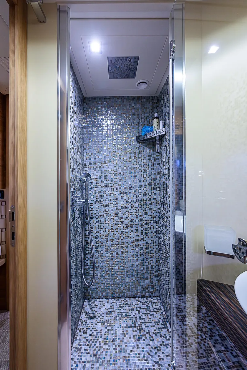 Slide: The Image of Luxurious shower with mosaic tiles in 2014 Pershing 92 yacht bathroom. - 30