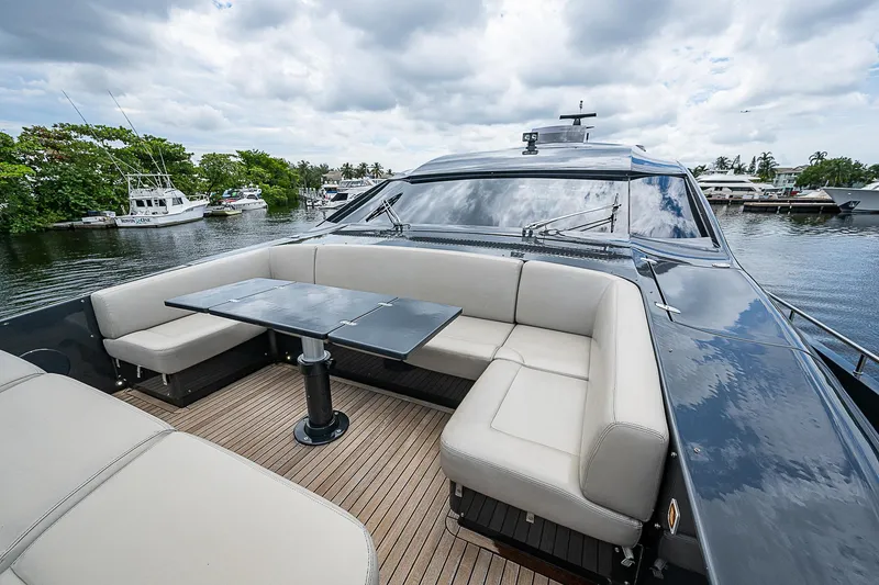 Slide: The Image of Luxurious 2014 Pershing 92 yacht with elegant outdoor seating and table on deck. - 37