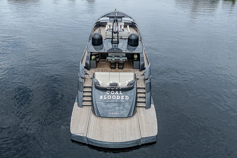 Slide: The Image of 2014 Pershing 92 luxury yacht on calm water, rear view. - 42