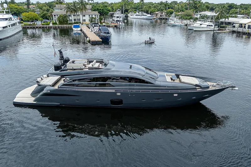 Slide: The Image of Luxurious 2014 Pershing 92 yacht docked in a serene marina setting. - 43