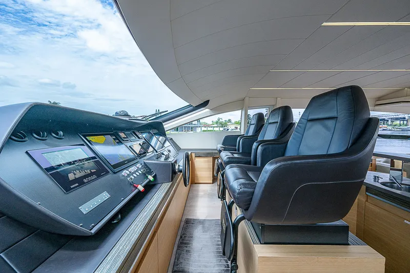 Slide: The Image of Luxurious 2014 Pershing 92 yacht helm with leather seats and advanced navigation controls. - 7