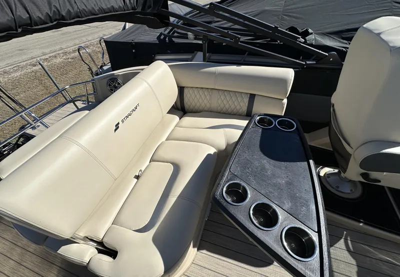Slide: The Image of Luxurious seating on 2024 Starcraft RX23QDC 3.0 boat with cup holders. - 14