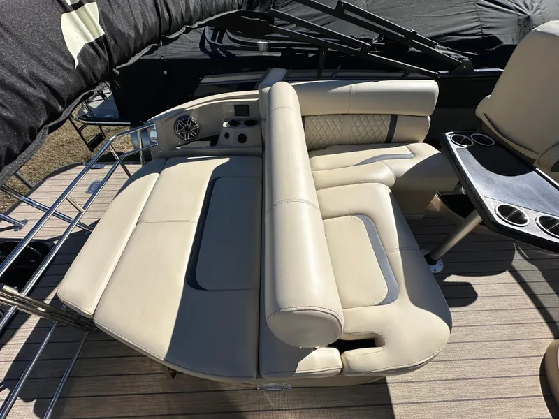 Slide: The Image of Luxurious seating on 2024 Starcraft RX23QDC 3.0 boat, featuring beige upholstery and cup holders. - 15