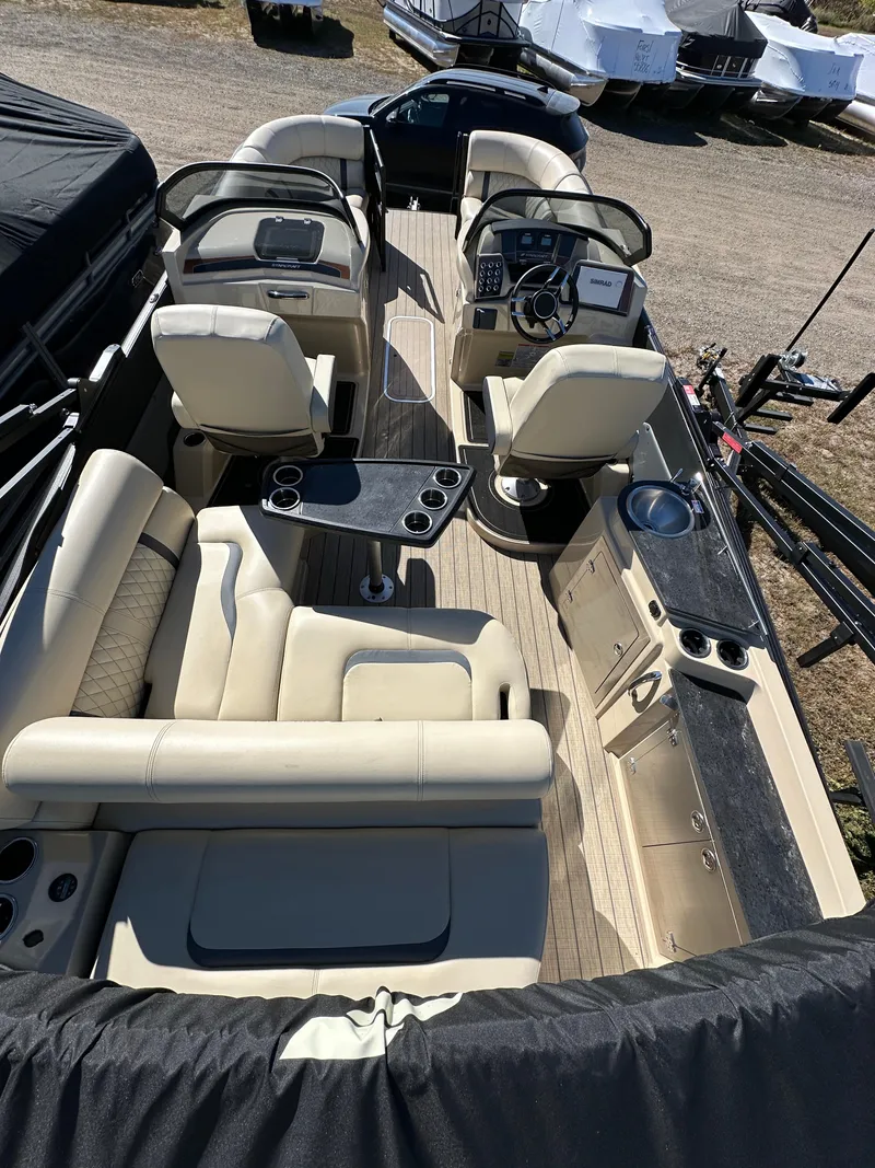 Slide: The Image of 2024 Starcraft RX23QDC 3.0 boat interior with luxurious seating and modern amenities. - 18