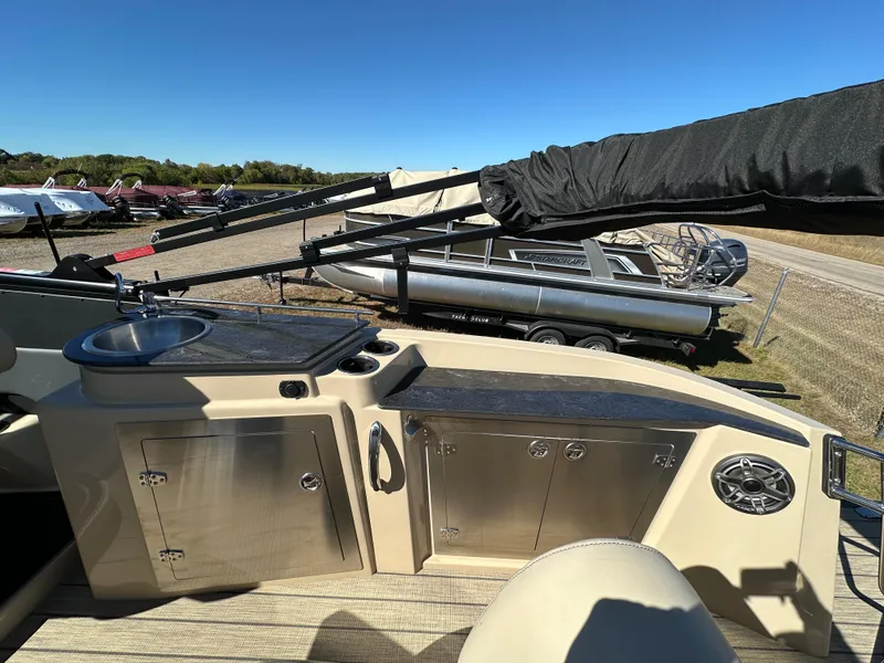 Slide: The Image of 2024 Starcraft RX23QDC 3.0 boat interior with sink and storage cabinets. - 21