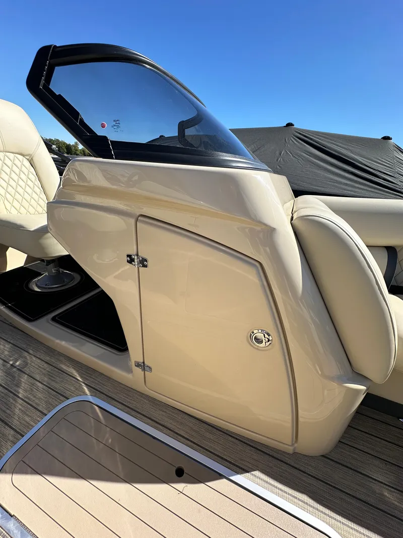 Slide: The Image of 2024 Starcraft RX23QDC 3.0 boat console with sleek design and beige finish. - 26