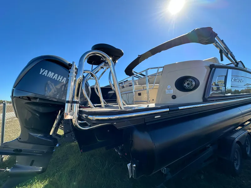 Slide: The Image of 2024 Starcraft RX23QDC 3.0 boat with Yamaha engine under clear blue sky. - 29