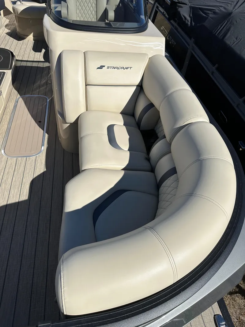 Slide: The Image of Luxurious seating on 2024 Starcraft RX23QDC 3.0 boat, featuring plush beige upholstery. - 4