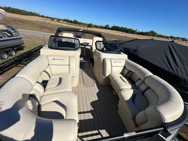Slide: The Image of 2024 Starcraft RX23QDC 3.0 boat with spacious seating and modern design. - 5