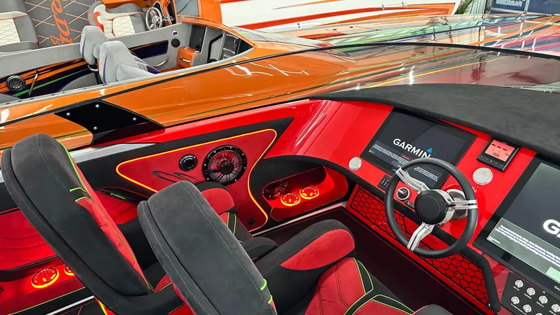 Slide: The Image of Luxurious Skater 438 boat interior, 2021 model, featuring vibrant red and black design with advanced controls. - 12