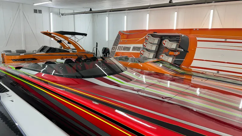 Slide: The Image of Colorful Skater 438 speedboats in a modern garage, 2021 models. - 13