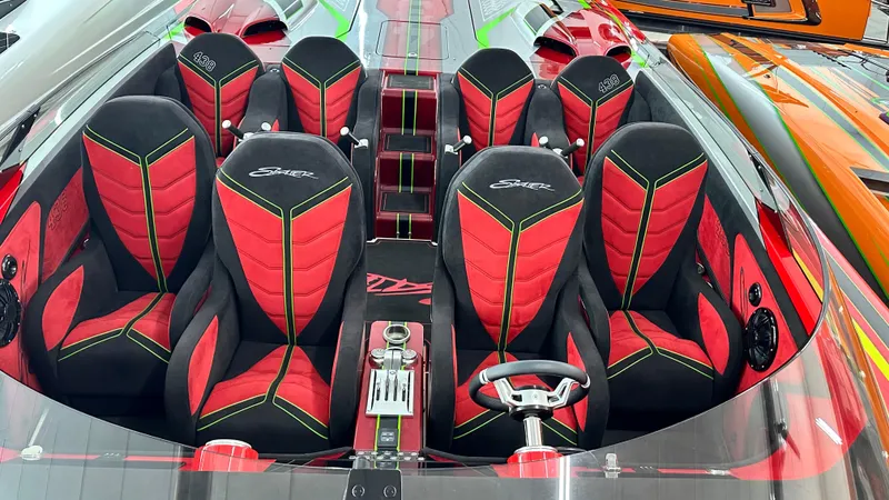 Slide: The Image of Luxurious Skater 438 speedboat interior, 2021 model, featuring red and black seating. - 15