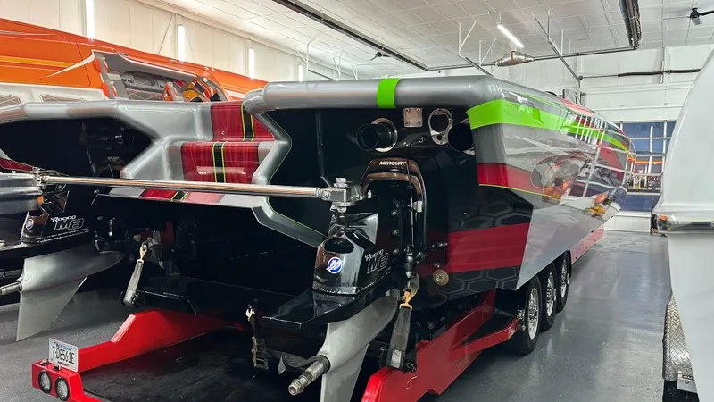 Slide: The Image of 2021 Skater 438 powerboat in a garage, showcasing vibrant design and powerful engines. - 19