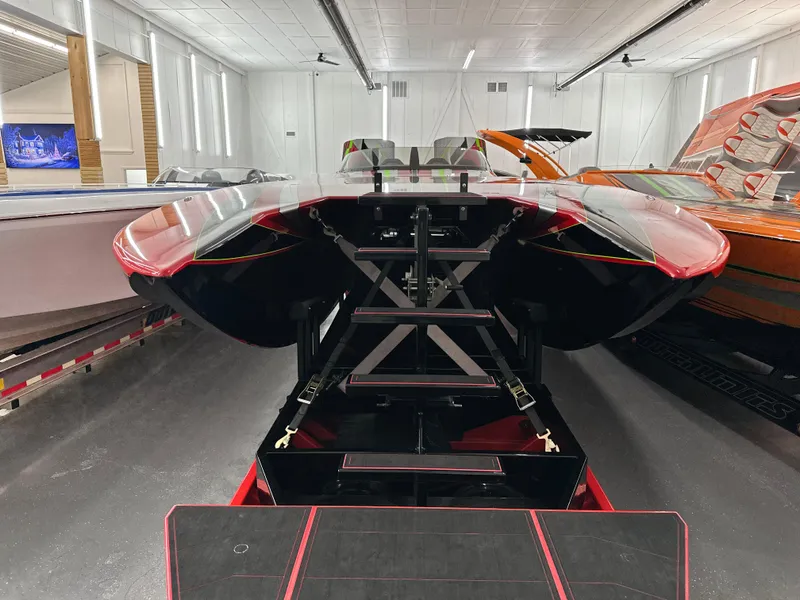 Slide: The Image of Red and black Skater 438 boat, 2021 model, displayed indoors. - 2