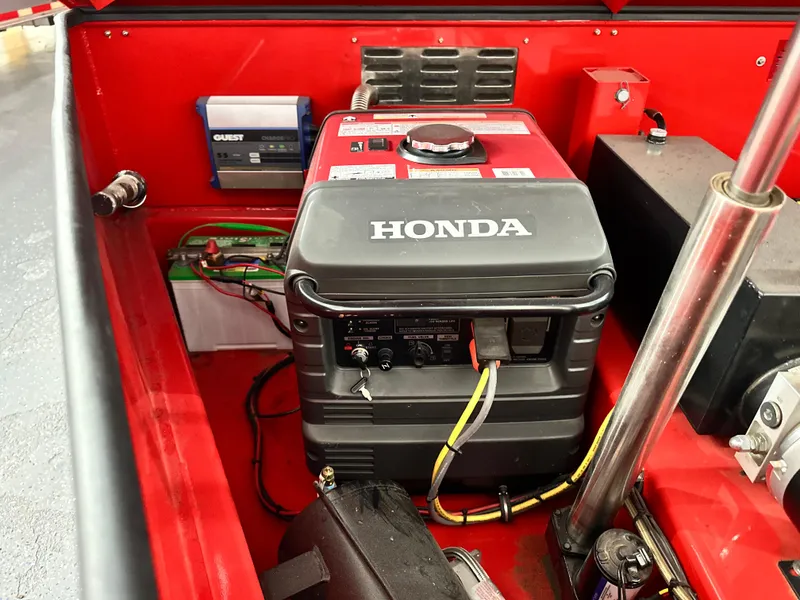 Slide: The Image of Honda generator in a Skater 438, 2021 model, red compartment setup. - 22