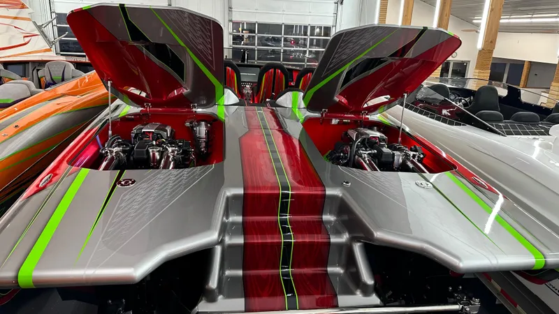 Slide: The Image of 2021 Skater 438 speedboat with open engine hatches, vibrant red and green accents. - 3