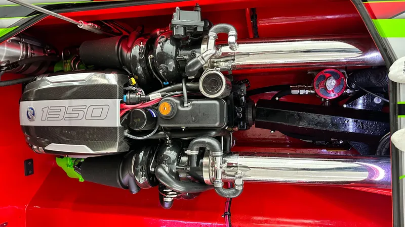 Slide: The Image of High-performance engine of a 2021 Skater 438 boat, featuring chrome exhausts and vibrant red accents. - 4