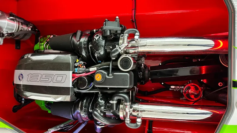 Slide: The Image of High-performance Skater 438 engine, 2021 model, with chrome exhausts and red background. - 6