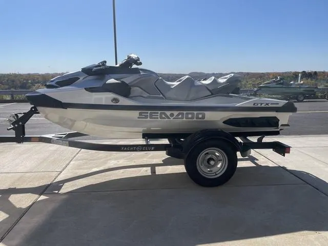 Slide: The Image of 2024 Sea-Doo Waverunner GTX on trailer, parked outdoors. - 5