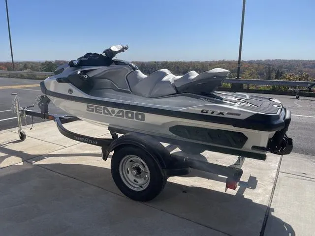 Slide: The Image of 2024 Sea-Doo Waverunner GTX on trailer, parked outdoors. - 6