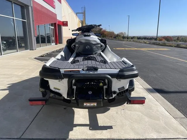 Slide: The Image of 2024 Sea-Doo Waverunner GTX parked outside a dealership on a sunny day. - 7