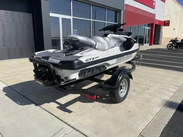 Slide: The Image of 2024 Sea-Doo Waverunner GTX on trailer, parked outside a dealership. - 8