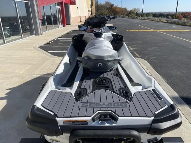 Slide: The Image of 2024 Sea-Doo Waverunner GTX parked outside dealership, rear view. - 9