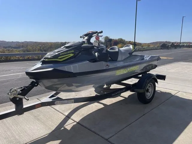 Slide: The Image of 2024 Sea-Doo RXT-X 325 Waverunner in Ice Metal/Mantagreen on trailer, parked outdoors. - 4