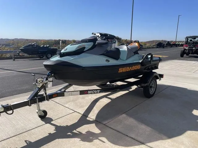Slide: The Image of 2024 Sea-Doo Waverunner Wake™ 170 on trailer, parked outdoors under clear sky. - 4