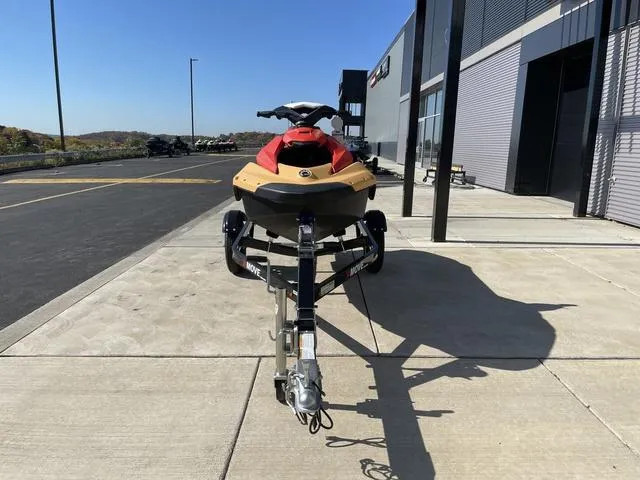 Slide: The Image of 2024 Sea-Doo Waverunner Spark on trailer, parked outside a modern building. - 5