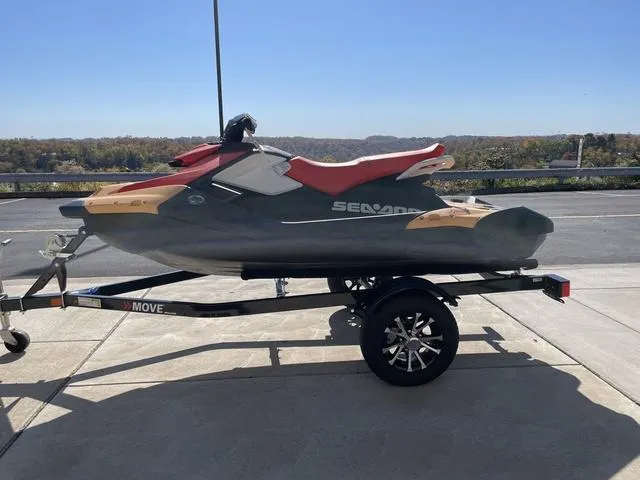Slide: The Image of 2024 Sea-Doo Waverunner Spark on trailer, parked outdoors. - 7