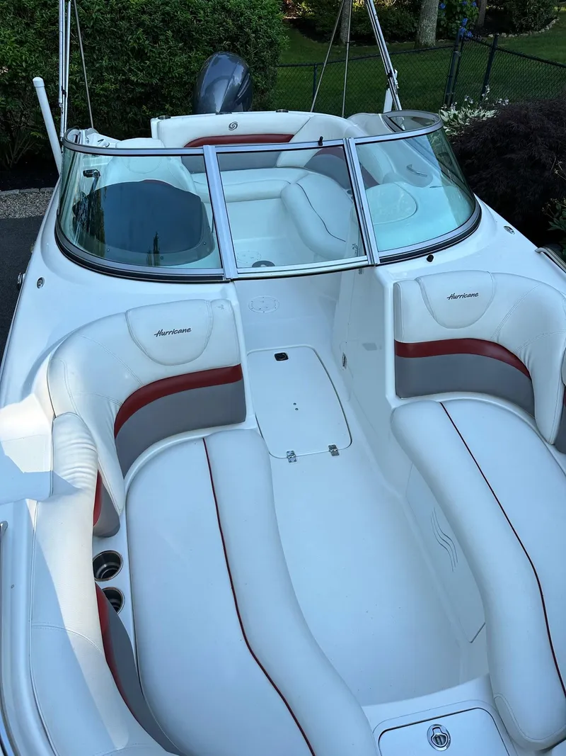 Slide: The Image of 2016 Hurricane SD2200 O/B boat with white and red seating, open deck view. - 11