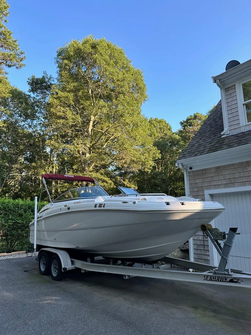 Slide: The Image of 2016 Hurricane SD2200 O/B boat on trailer beside house. - 12
