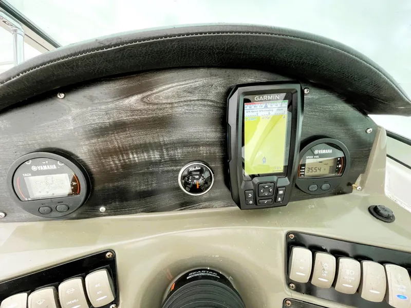 Slide: The Image of 2016 Hurricane SD2200 O/B dashboard with Garmin GPS and Yamaha gauges. - 13