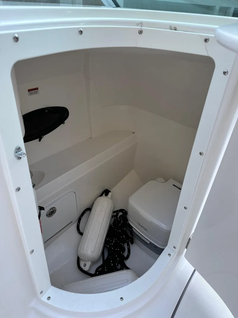 Slide: The Image of 2016 Hurricane SD2200 O/B boat storage compartment with marine equipment. - 3