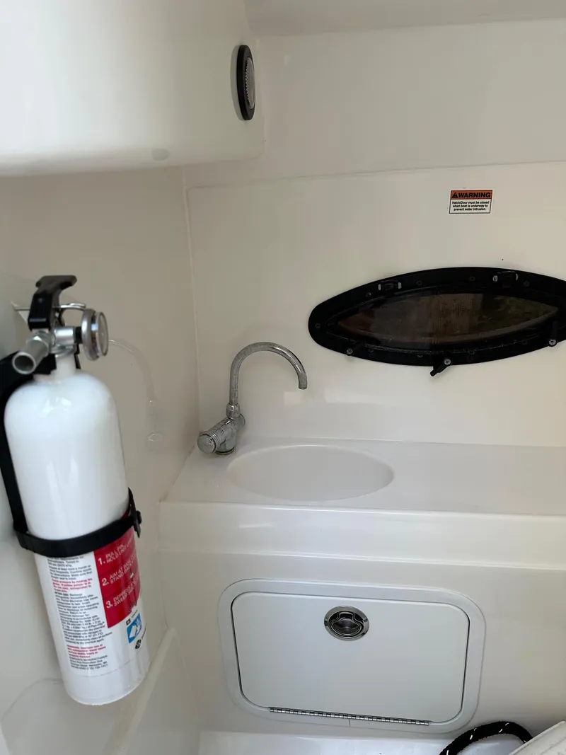 Slide: The Image of 2016 Hurricane SD2200 O/B boat interior with fire extinguisher and sink. - 4