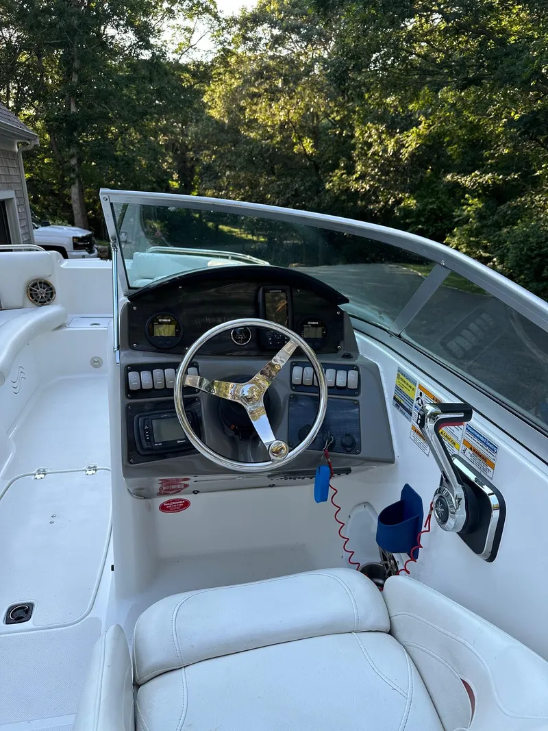Slide: The Image of 2016 Hurricane SD2200 O/B boat cockpit with steering wheel and controls. - 9
