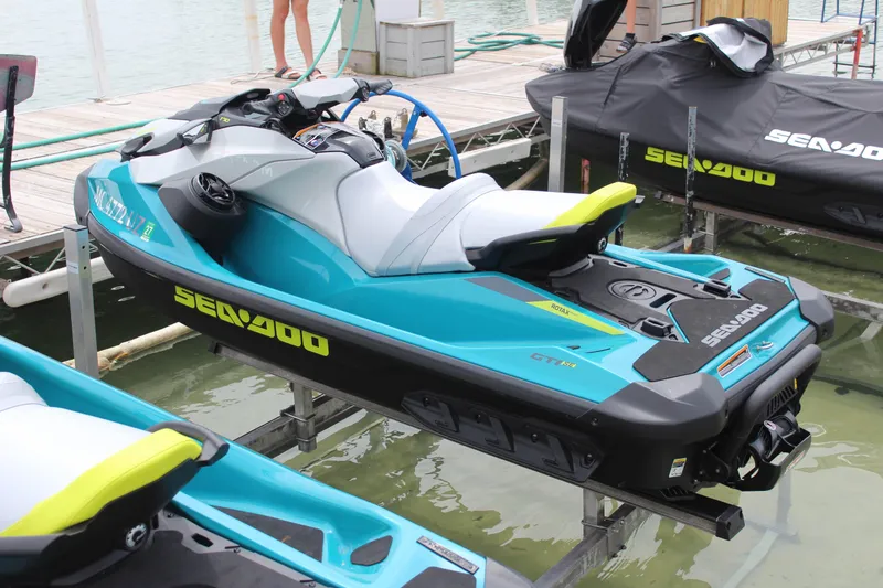 Slide: The Image of 2024 Sea-Doo GTI 170 jet ski docked at a marina, showcasing sleek design and vibrant colors. - 3